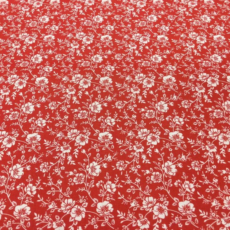 Bavlnená látka Biele kvety na červenom podklade