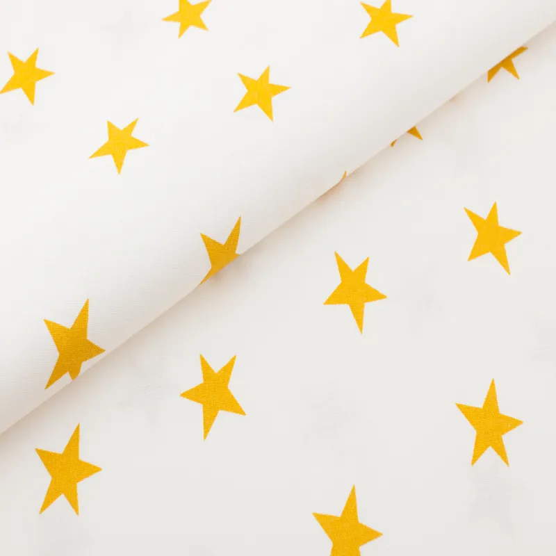 Bavlnená látka Horčicovožlté hviezdy na bielom podklade